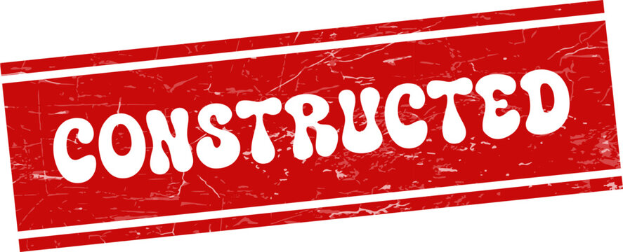A vibrant red grunge stamp clearly shows the word CONSTRUCTED in white lettering, representing creation and building