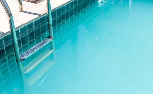 Cloudy swimming pool water background, poor water quality, swimming pool need service and maintenance 