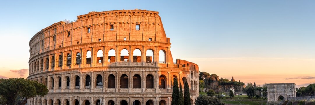 The Colosseum glowing red at sunset, Rome, Italy