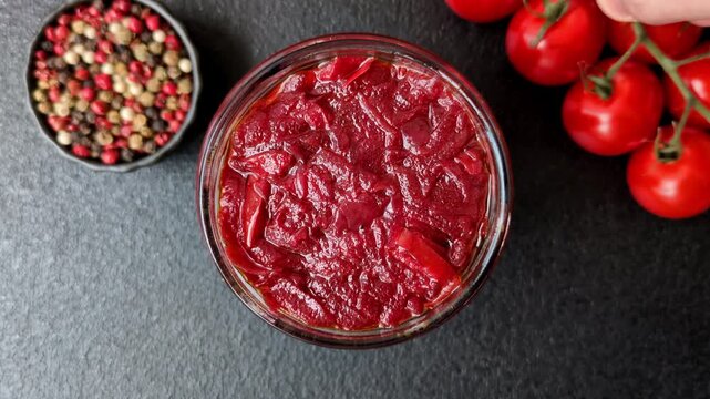 Grated beetroot with salt and spices as an ingredient for borscht or a vegan salad. Grated beetroot as a food background for your design