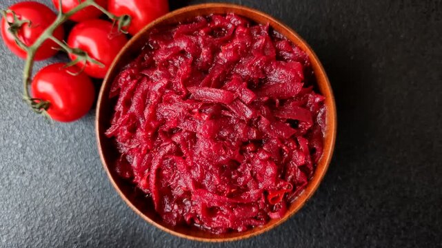 Grated beetroot with salt and spices as an ingredient for borscht or a vegan salad. Grated beetroot as a food background for your design