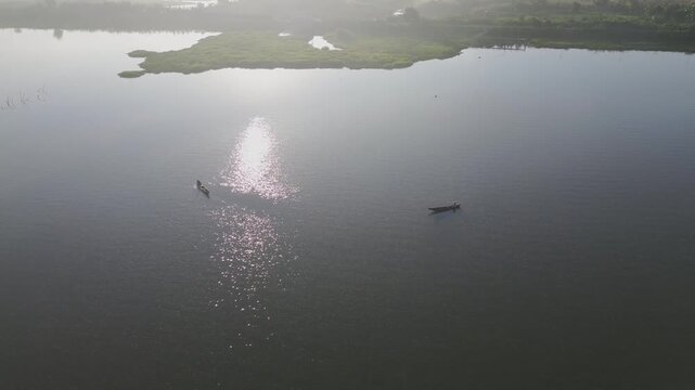 Aerial View of Two Boats on a Lake at Sunrise