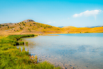 Fototapeta premium Deep blue waters of Vrazje Jezero (Devil's Lake) on the high plateau of Durmitor National Park, scenic mountain lake landscape in Montenegro.