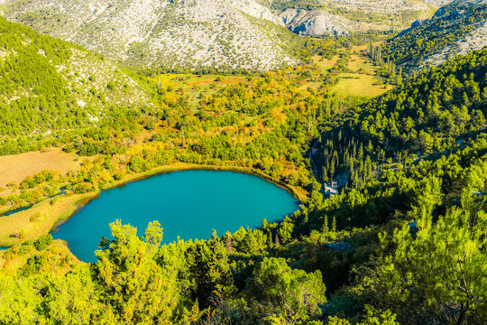 view Torak of the confluence where the Cikola river lake tributary joins the Krka river canyon, Krka National Park, Dalmatia, Croatia.