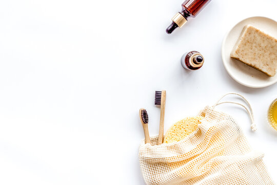 Self-care with herbal formulations - essential oils and soap - on white background top view copy space