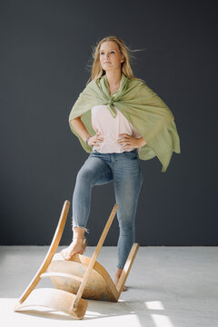 Portrait of blond young womanposing as a superheroine