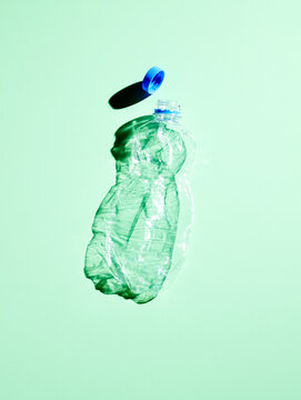 Plastic bottle on green background