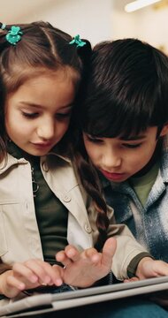 Children, relax and typing at house with tablet, browsing and download ebook for education. Family, kids and streaming in lounge with digital, watching video and educational games for online learning