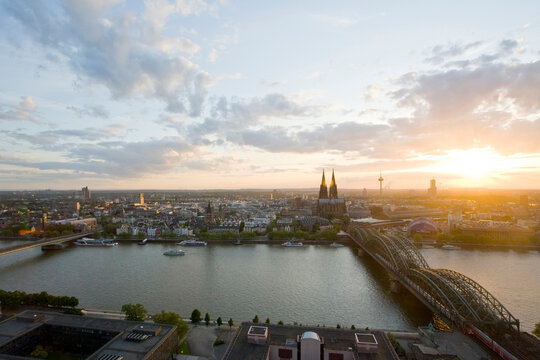 Aerial view of Cologne skyline and Rhine river at sunset
