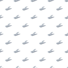 Fototapeta premium Repeating nail clippers forming a continuous, clean pattern on a white background