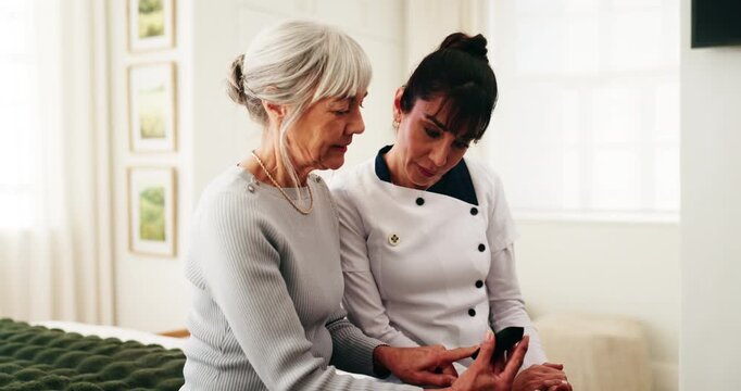 Caregiver, technology and senior woman with blood test for diabetes, elderly care and advice in home. People, pensioner and chat for healthcare, glucose check and medical monitor for exam and service