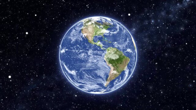 Realistic animation of the glowing blue planet earth rotating against a dark starry galaxy deep space background for scifi universe documentaries