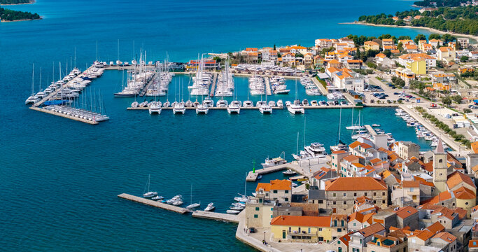Aerial view of Pirovac marina with yachts and historic waterfront in Croatia