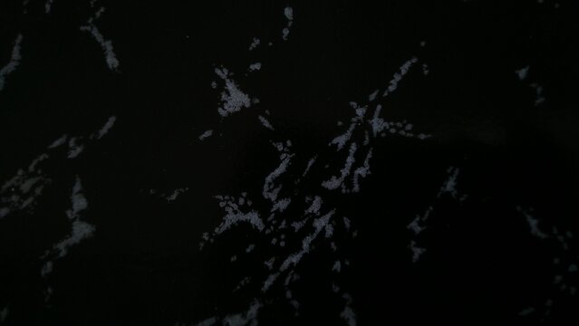 Dark Abstract Marble Textured Background with Organic Shapes.