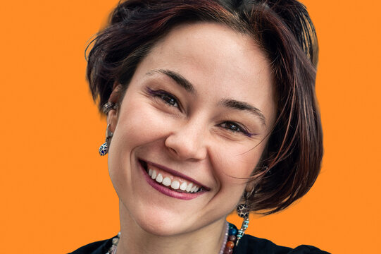 Close Up Portrait of Happy Smiling Young Woman Looking at Camera