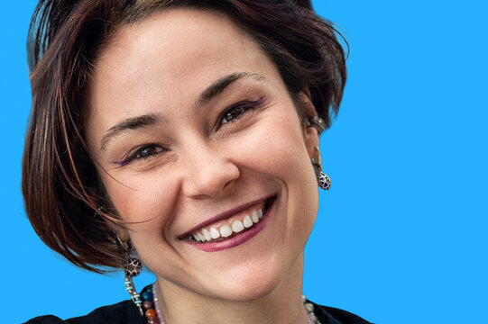 Close Up Portrait of Happy Smiling Young Woman Looking at Camera