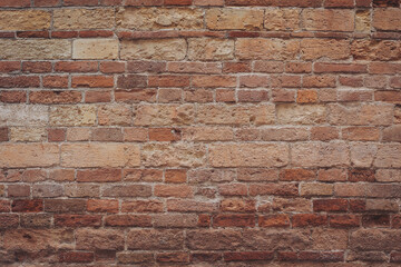 Fototapeta premium Timeless beauty of rustic brick wall showcasing history and character in warm earth tones