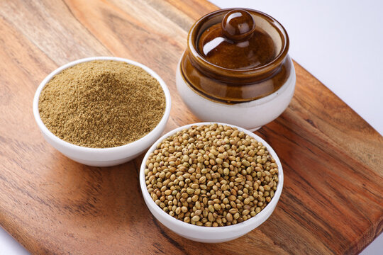 Indian spice called Coriander seeds or Dhania Khada and Dhaniya Powder selective focus 