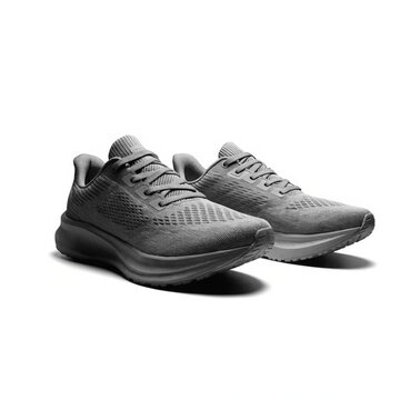 Neutral gray running shoes isolated on white with soft studio shadow, breathable mesh uppers, cushioned soles and modern athletic style for fitness, training, jogging, and sports retail
