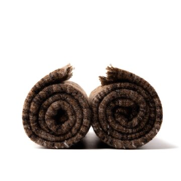 Rolled brown wool socks pair isolated on white, cozy winter apparel close up with soft studio shadow, rustic knitted texture, warm handmade comfort, minimalist product mockup for clothing retail