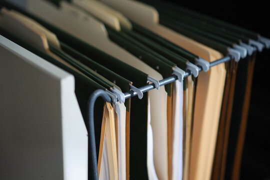 Office space file folders cabinet searching for documents, textured backgrounds copy space	