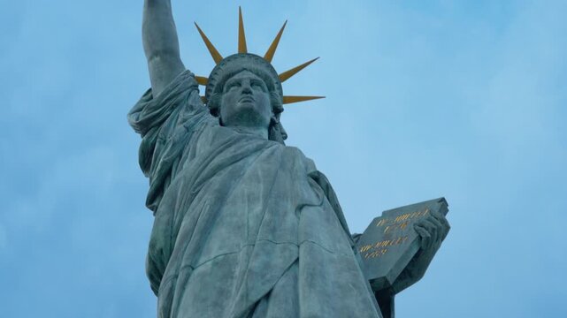 Statue of Liberty replica stands in Paris France as historical landmark sculpture symbolizing freedom and democracy for global travel industry tourism exploration attraction heritage monument.