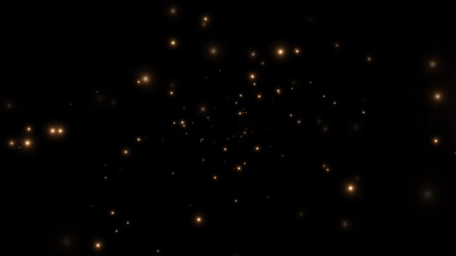 Golden sparkling particles flying outward from the center. Light effect on a black background. 4K video.