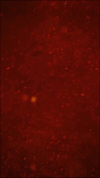 Fiery embers and glowing particles float in warm, abstract motion graphics