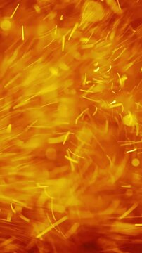 Abstract golden particles swirling and dancing in a vibrant, energetic motion
