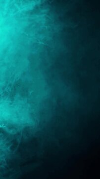 Abstract teal smoke swirling and dissipating in dark moody atmosphere