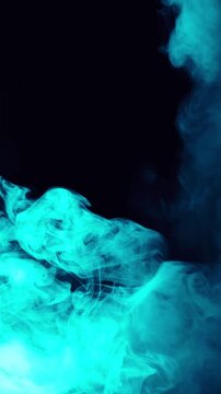 Vibrant blue smoke swirls and dances against a dark background