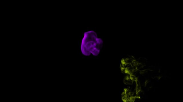 Vibrant colored smoke plumes rise and swirl against a stark black background