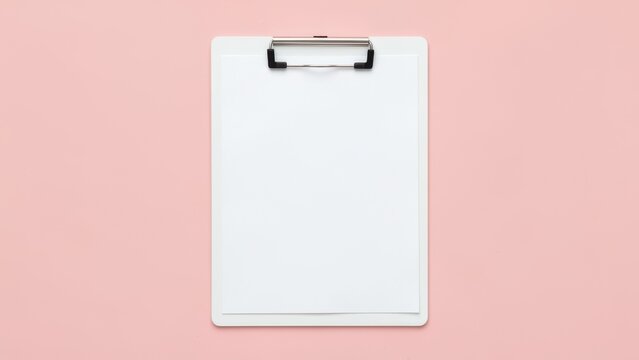 overhead flat lay blank clipboard paper on pastel blush pink background for planning productivity mockups fresh clean organization concept