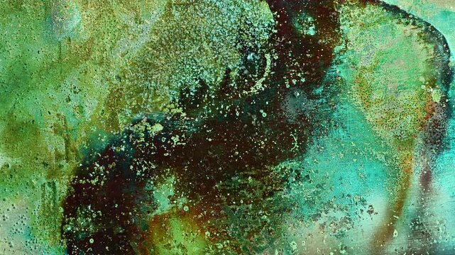 Timelapse of copper oxidation showing colorful patina formation and verdigris development. Chemical reaction transforms the metal surface into an abstract texture with evolving corrosion patterns and 
