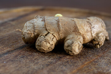 Fototapeta premium Ginger Root on Wooden Surface