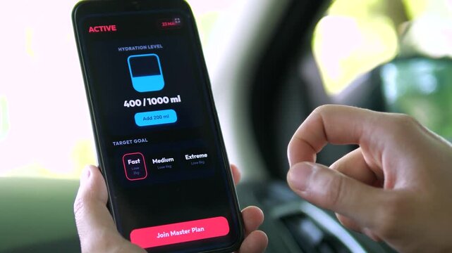 Viewing a hydration level tracker on a smartphone. The screen displays 400, 1000 ml with an Add 200 ml button and target goals. Perfect for fitness apps, health tracking, and wellness visuals.