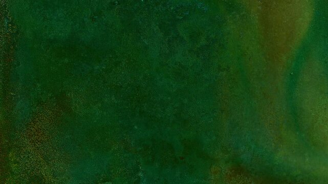 Timelapse of copper oxidation and verdigris formation. Colorful chemical reaction creates evolving abstract patterns and textured metal surface with natural corrosion over time