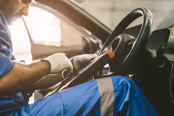 Professional mechanic using OBD2 scanner to inspect vehicle. Car diagnostic and maintenance service. © Quality Stock Arts