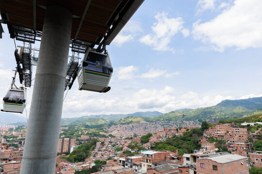 Metrocable (Medell&iacute;n Metro Cable) aerial view with hillside neighborhood in the Aburr&aacute; Valley under daylight