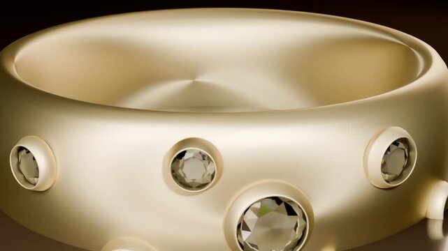 Pulling back camera revealing gold ring on glossy tabletop, showing bezel-set gems and satin finish