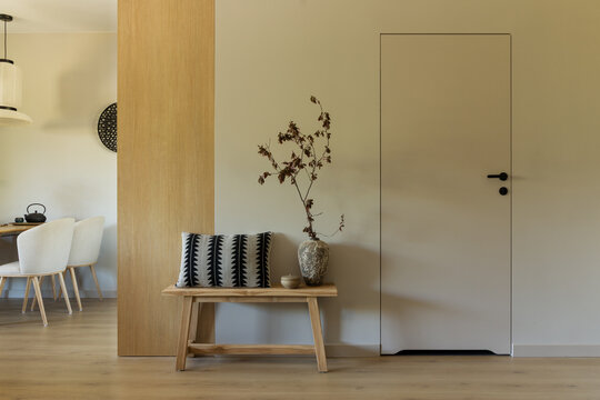 Modern Interior with Wooden Bench, Neutral Tones, and Contemporary Design Elements in a Home Setting