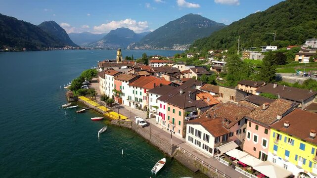 Cinematic Aerial Drone View of Colorful Village Brusino Arsizio Lake Lugano Switzerland Authentic Swiss-Italian Lakeside Charm Vibrant Mediterranean Architecture Scenic Mountains Summer 4K Travel Foot