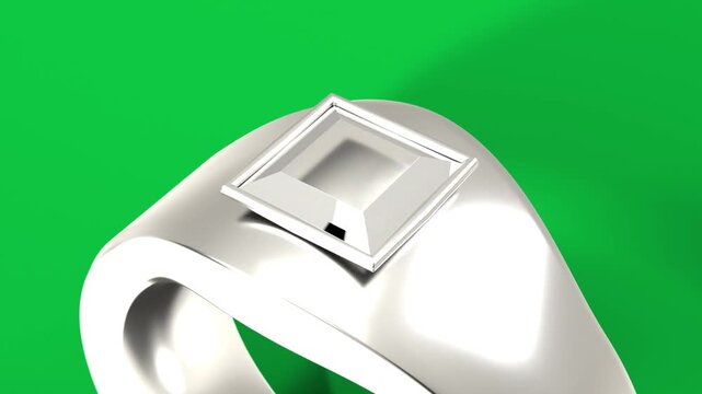 On play, metal signet rotating, camera pulling back, facets flashing for demo, transparent backdrop
