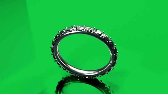 Playback silvery eternity ring rotating, tilting to reveal gemstones, inner band on transparent bg