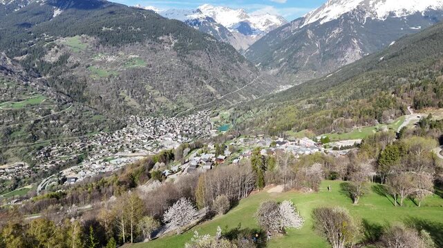 Aerial panaromic view of Courchevel, Bozel and Saint Bon between snowy mountains in spring 

