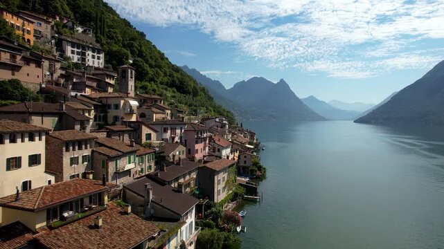 Cinematic Slow Drone Flight Along Colorful Lakeside Houses and Boats in Gandria Village Lake Lugano Switzerland Iconic Cascading Architecture Authentic Mediterranean Atmosphere Travel 4K Footage