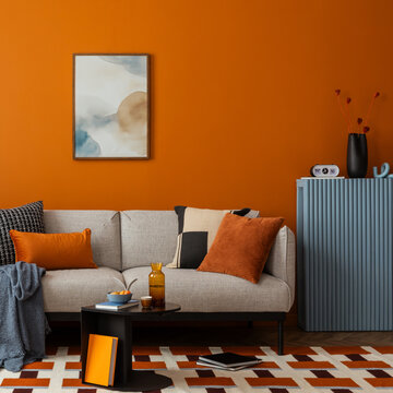 Modern Living Room Interior with Stylish Decor and Vibrant Orange Wall