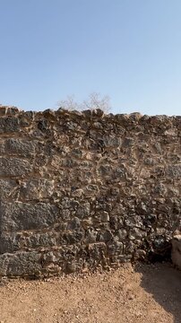 Explore the ancient stone ruins of the historic othman well in Madina, Saudi Arabia.