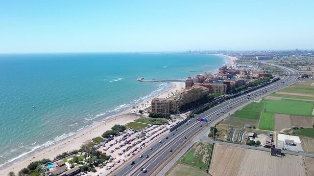 Drone aerial view of Port Saplaya, a colorful residential marina and beach in Valencia, Spain