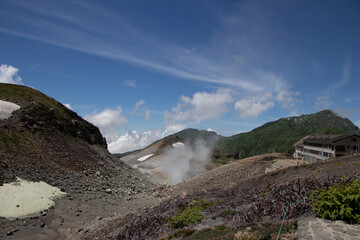 Volcanic crater valley with a mountain lodge building © kodai